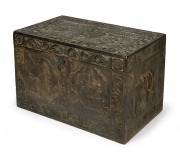 An antique Burmese carved timber trunk, adorned with elephants and hunting scenes, 19th century, 53cm high, 84cm wide, 51cm deep.