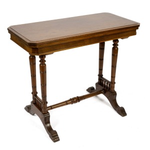 An antique English walnut fold-over games table, late 19th century, ​​​​​​​76cm high, 92cm wide, 45cm deep.