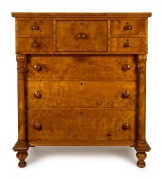 A Colonial huon pine eight drawer cantilever chest with full turned columns and carved corbels, huon pine secondary timbers, Tasmanian origin, circa 1840s, 137cm high, 122cm wide, 58cm deep.
