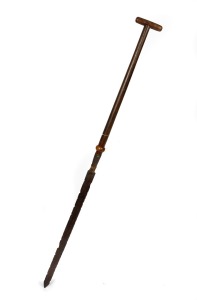 An antique blubber knife with later wooden handle. Note: Used for cutting blanket pieces of blubber for processing on board ship. The blade 85cm long, 154cm overall including handle.