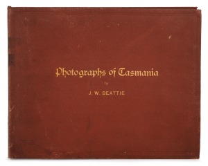 PHOTOGRAPHS OF TASMANIA by J.W. BEATTIE housed in an attractive album with gilt title to the cover, containing 23 albumen prints affixed to pages with hand-written notations and printed captions, images mainly 21 x 26.5 cm.