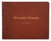 PHOTOGRAPHS OF TASMANIA by J.W. BEATTIE housed in an attractive album with gilt title to the cover, containing 23 albumen prints affixed to pages with hand-written notations and printed captions, images mainly 21 x 26.5 cm.