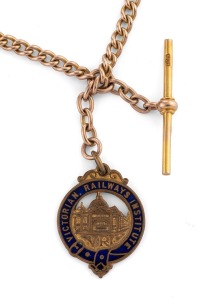FLINDERS STREET STATION: 1910s fob by White Bros., attached to 9ct gold chain with T-bar, the fob featuring text "Victorian Railways Institute - V.R.I." and impressed with image of Flinders Street Station, with engraving "1213" verso; 27.7g overall.