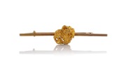 An antique 15ct gold bar brooch with impressive gold nugget specimen, 19th century, 5.2cm wide, 5.7 grams.