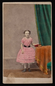 A hand-coloured carte-de-viste by C. Nettleton of 1 Madeline Street, North Melbourne (NB rare as this address has not been noted in The Mechanical Eye in Australia: Photography 1841&ndash;1900), with note in ink on reverse "With Babs love to Miss Ellen Bayles".