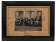 Signed photograph of TRH The Duke and Duchess of Cornwall and York (later King George V and Queen Mary) and their royal suite on the garden steps of Government House, Melbourne, 9 May 1901, by Vandyck Studios, Melbourne; attractively framed in ebonized ti