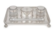 Queen Victoria royal presentation sterling silver inkstand, rectangular tray with gadrooned border, central stamp box with royal inscription "From VRI 1899", flanked by two inkpots in cut crystal with silver lids; gifted to The Rt Hon Lord Hallam Tennyson
