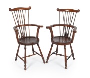 A. J. WHITE, IMPORTER & MANUFACTURER, CHRISTCHURCH, pair of mahogany comb back armchairs, circa 1900, with original brass ratiler's plaque to the underside of one chair, 104cm high, 70cm across the arms.