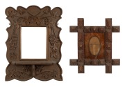 An antique Australian tramp art cedar picture frame; together with a carved kauri pine picture frame with shelf and grape decoration, 19th/20th century, (2 items), the larger 56 x 44cm overall.