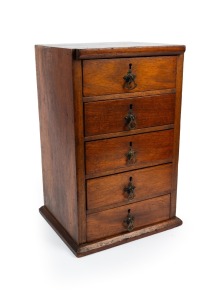 An Australian hardwood five drawer miniature chest, 19th/20th 47cm high, 31cm wide, 26cm deep.