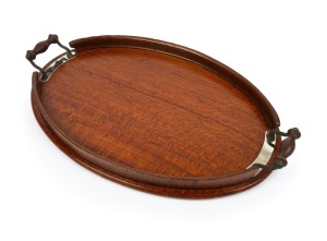 A vintage Australian silky oak oval serving tray with gallery edge, early to mid 20th century, 54cm across the handles.