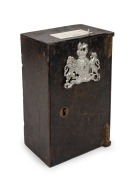 An antique strongbox with applied silver finished British coat of arms, with original key, accompanied by a birthday note dated 1909, 19th/20th century, 26cm high, 16cm wide, 12cm deep.