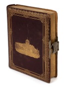 An antique photo album containing 70+ carte-de-visite and cabinet cards, attractively displayed in gilt embossed leather album depicting the law courts of Melbourne on the cover, with numerous colour lithograph pictorial pages representing various colonie