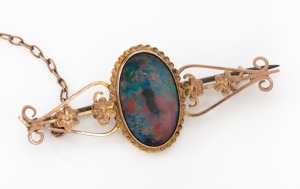 A vintage 9ct gold and opal doublet brooch, 20th century, 4.5cm wide, 3.5 grams.