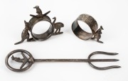 Antique Australian silver plated bread fork and two napkin rings with kangaroos, kookaburras and emu, 19th/20th century, (3 items), ​​​​​​​the fork 20.5cm long.
