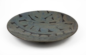 GREG DALY pottery charger with hand-painted decoration, signed "Daly", 46.5cm diameter.