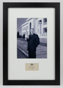 PRIME MINISTER BEN CHIFLEY (1885-1951): Original c. 1940s signature on paper bearing the Commonwealth Coat of Arms beneath photograph of Chifley in front of Old Parliament House; framed and glazed, 49 x 34cm overall.