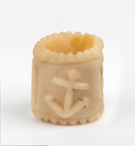 An antique carved whalebone sailor's sweetheart toggle, 19th century, 2cm high.