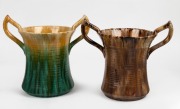 JOHN CAMPBELL green and yellow glazed two handled pottery vase; together with a mottled brown glazed example of the same shape, (2 items), both incised "John Campbell, Tasmania", 26cm high, 29cm across the handles.