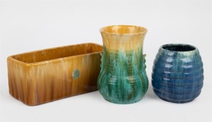 JOHN CAMPBELL brown and yellow glazed pottery trough; together with a blue glazed pottery vase and a green and yellow glazed pottery vase, (3 items), all incised "John Campbell", the trough 10cm high, 25.5cm wide.