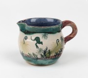 ARTHUR MERRIC BOYD and NEIL DOUGLAS pottery cream jug with hand-painted kangaroos in landscape, signed "Neil Douglas, A. M. Boyd, Australia, 1950", 6cm high.