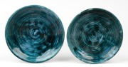 ARTHUR MERRIC BOYD pair of blue glazed pottery dishes, both incised "A. M. B." and one with additional Primrose Pottery Shop ink stamp to base, 16cm diameter.