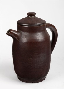 HAROLD HUGHAN copper glazed pottery coffee pot, signed "Hughan", 22cm high.