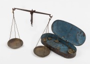 Antique pocket gold scales in metal case with assorted weights, mid 19th century, the case 17cm wide.