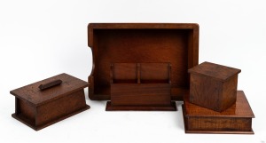 An Australian blackwood box with original paper label "Shott & Son"; together with an Australian cedar desk tidy, a grevillea arts & crafts box, a silky oak in/out desktop tray and a burl timber box, 20th century, (5 items), the in/out tray 38cm wide.