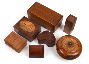 Assorted boxes including a circular blackwood example with silver map of Australia, a jarrah example in the shape of the map of Australia, fiddleback blackwood, myrtle and others, 20th century, (7 items), the largest 20cm wide.