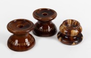 Three antique Australian Colonial pottery candle holders, 19th/20th century, the largest 8cm high.