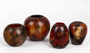 Four assorted Australian pokerwork vases, circa 1920, the largest 13cm high.