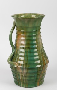 REMUED ribbed green glazed pottery vase with applied branch handle (rare shape), incised signature "Remued, 463", 38cm high.
