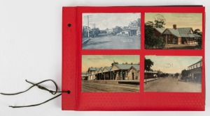 An old time red oblong album of antique and vintage postcards, mostly Western Australian themes including some interesting flood scenes.
