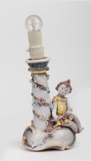 A vintage figural pottery table lamp base, signed "K. H. B.", 30cm high including fitting.