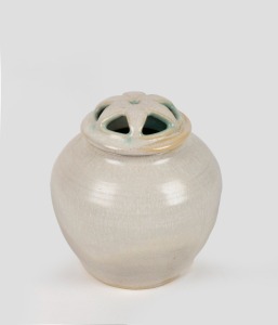 McCREDIE cream and blue glazed lidded potpourri vase with flannel flower decoration, incised "McCredie, N.S.W.", 9.5cm high.