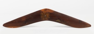 EDWIN PAREROULTJA hand-painted boomerang with floral decoration, circa 1950s, signed right middle lower edge and inscribed verso "Aboriginal Made, Hermannsburg, Central Australia", 40cm long.