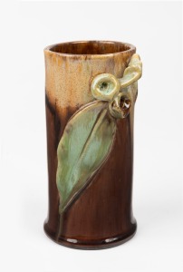 REMUED brown and green glazed pottery vase with applied gumnuts and leaf, incised "Remued", 145/6M, 15.5cm high.