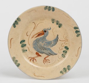 FLORA LANDELLS pottery plate with sgraffito and hand-painted pelican decoration, signed "Landells, Perth", 18.5cm diameter.