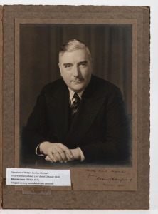 SIR ROBERT MENZIES: Portrait by Dickinson-Montreath Studio (Melbourne), mounted on card, with signature and dedication "With kind regards from Robert G. Menzies - October 1940", being early in his first Prime Ministerial term; 35 x 25cm overall.