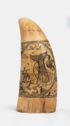 A scrimshaw whale's tooth with whaling scene 12cm high.