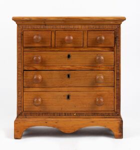 An antique pine miniature chest of six drawers, 19th/20th century, 37cm high, 34cm wide, 18cm deep.