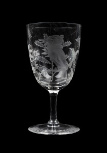 An antique wine glass, beautifully decorated with wheel engraved kookaburra, waratah, flannel flowers and butterflies, 19th century, 14cm high.