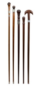Five assorted timber walking sticks some with silver collars, 19th/20th century, the largest 94cm high.