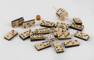 Antique whalebone and ebony domino tiles (not complete), together with a whalebone gaming top and assorted dice, (qty)