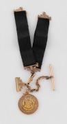 WILLIS & SONS of Melbourne antique 9ct gold and black silk fob chain, together with a SIMONSEN of Melbourne 9ct gold patriotic fob with Australian coat of arms, circa 1900, ​​​​​​​11.8 grams including silk ribbon.