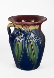 REMUED pottery vase with applied gumnuts and leaves, incised "Remued 196/7M, Hand Made", 19cm high.