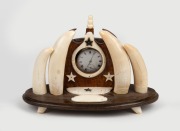 An Australian folk art pocket watch holder crafted from whalebone, whale's teeth and timber, 20th century, 15cm high, 22cm wide.