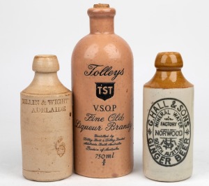 DILLIN & WIGHT ADELAIDE pottery ginger beer bottle (by Doulton Lambeth), G. HALL & SONS, NORWOOD pottery ginger beer bottle, and a TOLLEYS BRANDY pottery bottle (by Elischer), (3 items), the largest 23.5cm high.