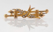LARARD BROS. of Melbourne antique 9ct gold brooch with swallow decoration adorned with seed pearls, 19th/20th century, stamped "9ct" flanked by pictorial marks, 5cm wide, 3 grams.